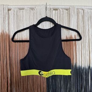 Black Ethika high neck performance style sports bra with neon yellow accents